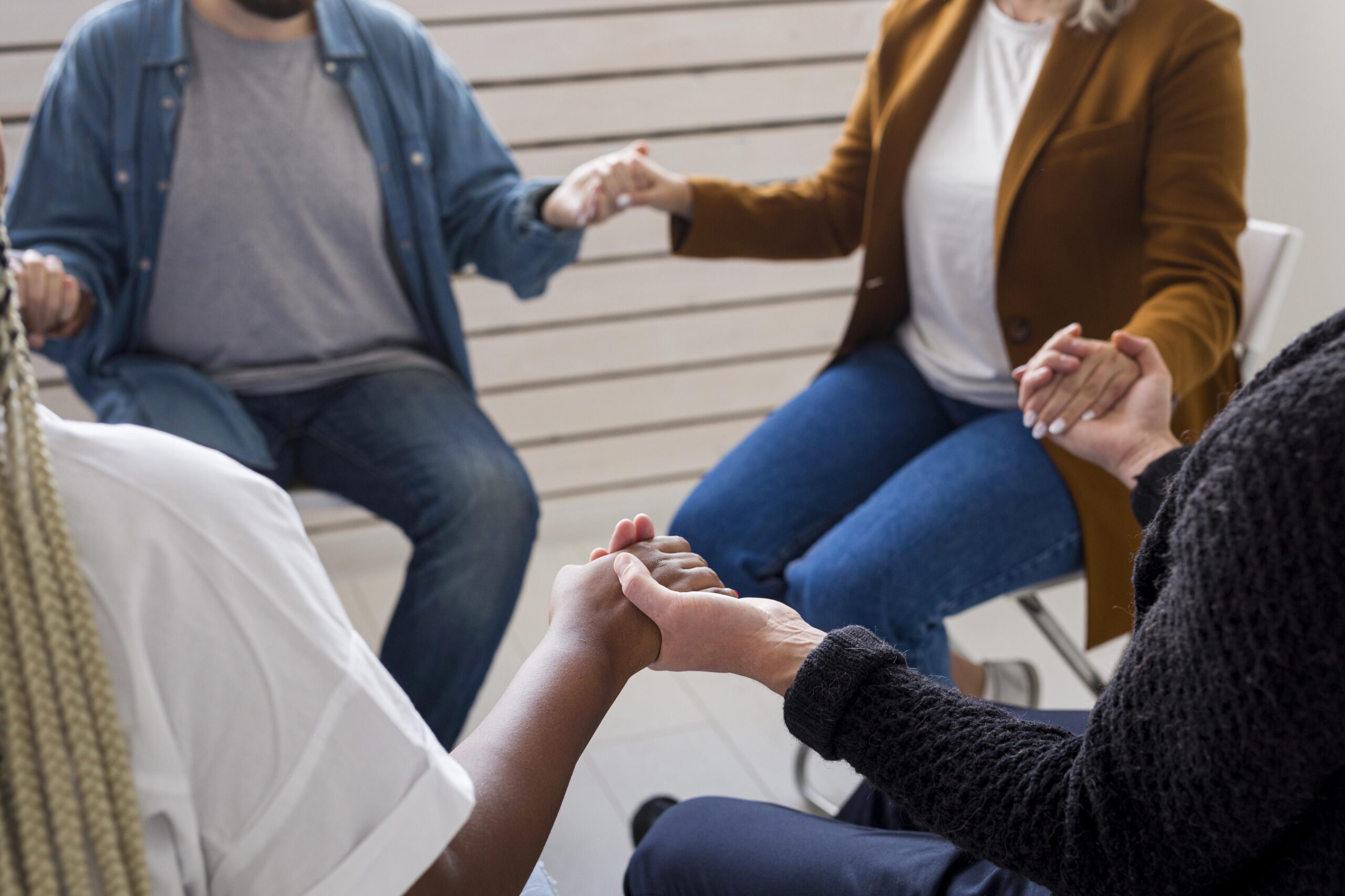 close-up-community-holding-hands
